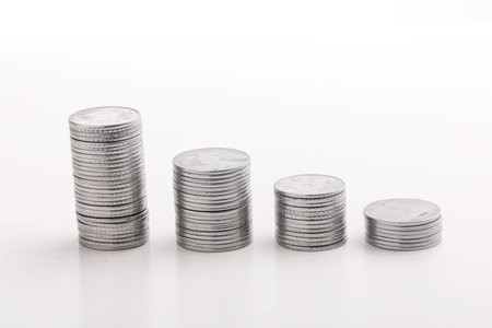 Stack of indian currency in coins  arranged as a graph on white background