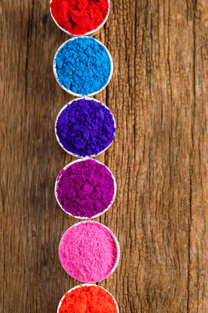 Indian Festival Holi, Multi color's cup on dark backgroundの写真素材