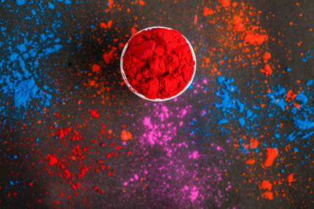 Indian Festival Holi, Multi color's cup on dark backgroundの写真素材