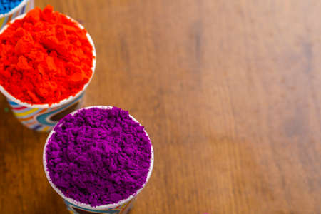 Indian Festival Holi, Multi color's cup on dark backgroundの写真素材