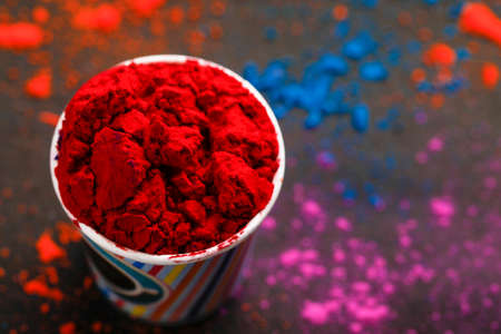 Indian Festival Holi, Multi color's cup on dark backgroundの写真素材