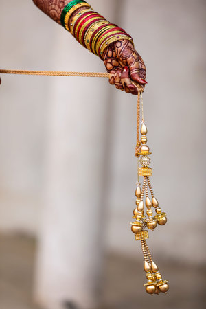 Indian wedding ceremony : bangle in bridal hand with mehandi design