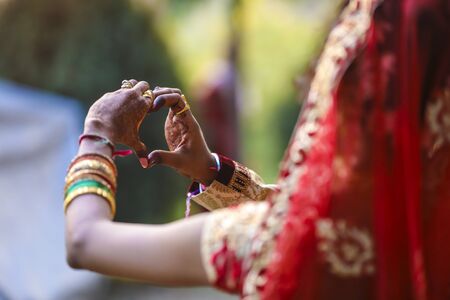 Indian wedding ceremony : bangle in bridal hand with mehandi designの写真素材