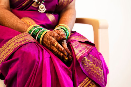 Indian wedding ceremony : bangle in bridal hand with mehandi designの写真素材