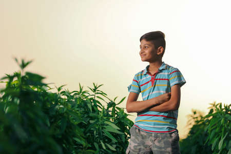 Happy indian child playing at groundの写真素材