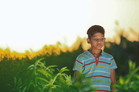 Happy indian child playing at groundの写真素材