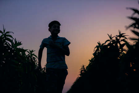 Happy indian child playing at groundの写真素材