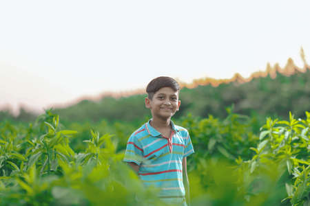 Happy indian child playing at groundの写真素材