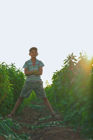 Happy indian child playing at groundの写真素材