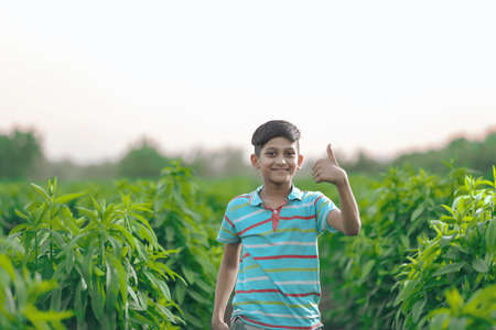 Happy indian child playing at groundの写真素材