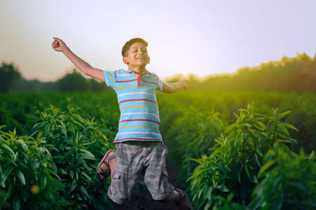 Happy indian child jumping in airの写真素材
