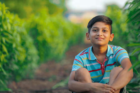 Happy indian child playing at groundの写真素材