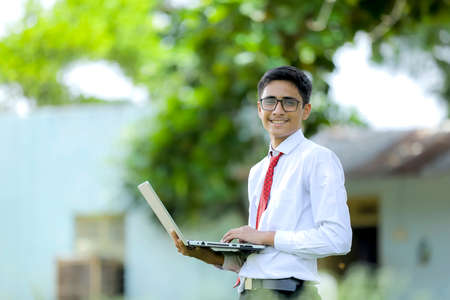 Indian boy using laptop , Online education conceptの写真素材