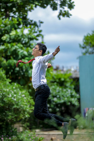 Indian Student achieving success , Jumping in air
