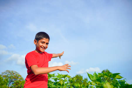 Happy indian child playing at groundの写真素材