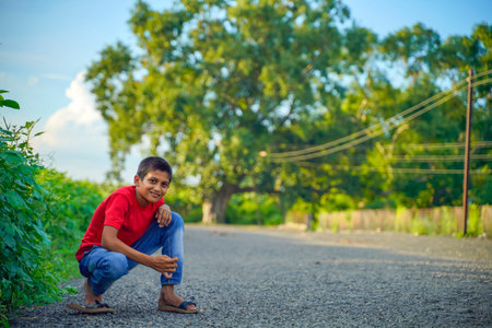 Happy indian child playing at ground