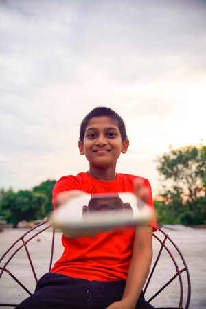 Indian Cute Little Boy With Cellphone