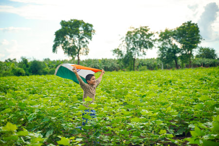 Indian child celebrating Independence or Republic day of Indiaの写真素材