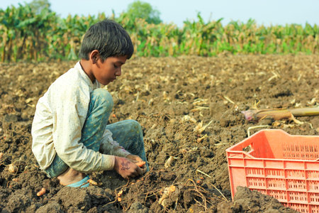 Jalgaon, India - March 17, 2020: Poor indian children playing at field , rural life of Indiaのeditorial素材