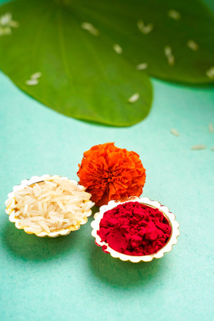 Indian festival dussehra , green leaf, rice and flowersの写真素材