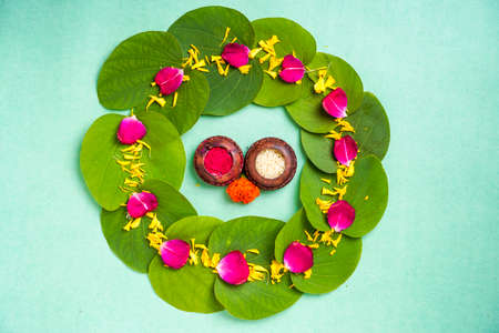 Indian festival dussehra , green leaf, rice and flowersの写真素材