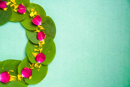 Indian festival dussehra , green leaf, rice and flowersの写真素材