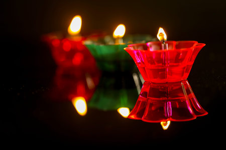 Indian festival diwali , Colorful lamps of oil on dark background