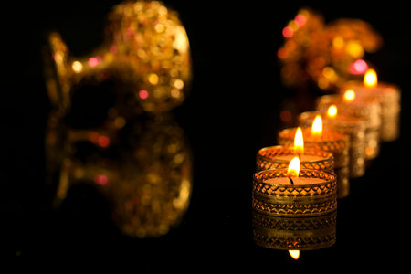 Indian festival diwali , candle on dark background
