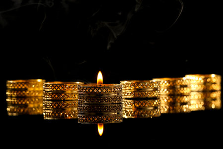 Indian festival diwali , candle on dark background