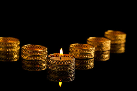 Indian festival diwali , candle on dark background