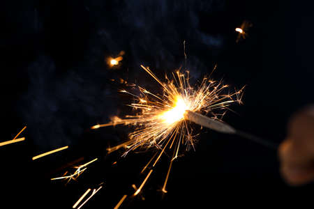 The burning sparklers diwali festival. Celebrating Diwali in india.の写真素材