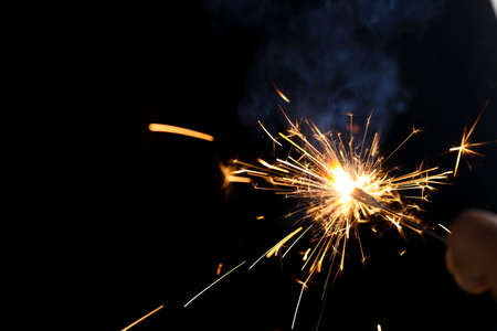 The burning sparklers diwali festival. Celebrating Diwali in india.の写真素材