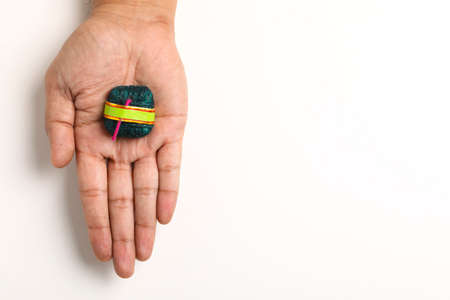 Diwali handmade bomb in hand on white background,の写真素材