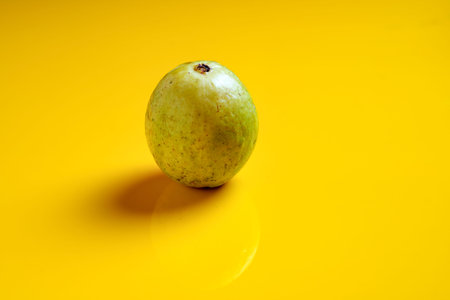 Guava or Psidium guajava Linn , fruits on yellow background.