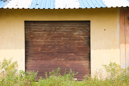 old and rusty iron shutterの写真素材