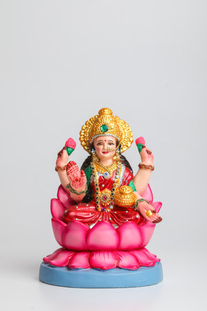 Beautiful Clay Idol of Hindu Goddess Lakshmi OR Laxmi on white backgroundの写真素材