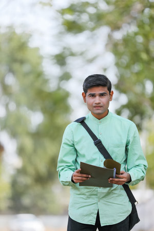 Young indian college student or job seeker with Holding file in Hand.の写真素材