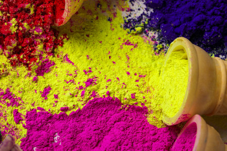 colors in shapes of ice cream scoops in cones for Indian holi festivalの写真素材