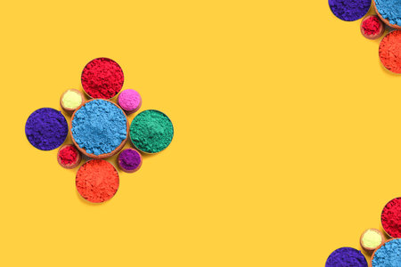 Indian festival Holi , Multi color's bowl on yellow backgroundの写真素材