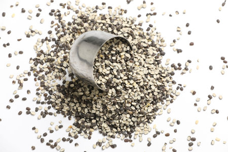 Split Black Lentil Also Know as Black Gram, Black Urad Dal, Vigna Mungo, Urad Bean on White...