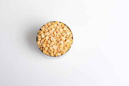 Dried chickpeas in bowl isolated on white background.