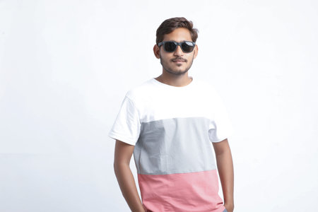 Young handsome indian college student giving expression on white background.
