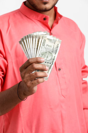 Indian man counting newly launched indian five hundred rupees. Money counting background business...
