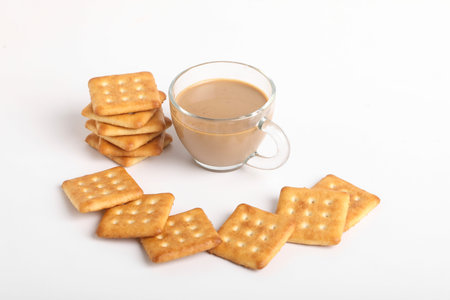 Morning breakfast concept. tea cup and Biscuit on white background.