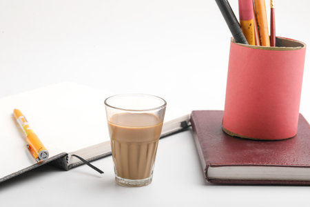 Diary and pen with cup of tea. work from home conceptの写真素材