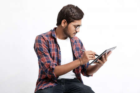 Indian Professional designer using graphic tablet connected to smartphone with digital pen.の写真素材