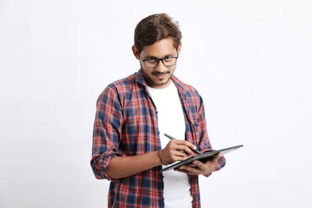 Indian Professional designer using graphic tablet connected to smartphone with digital pen.の写真素材
