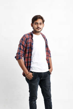 Indian or Asian man giving multi pal expression over white backgroundの写真素材