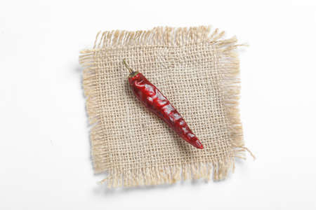 Dried red chilli on white background.の写真素材