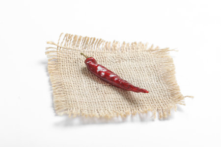 Dried red chilli on white background.の写真素材
